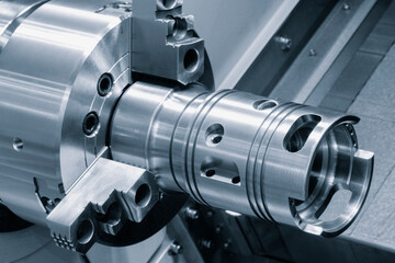 Obraz na płótnie Canvas Metal machine tools industry. CNC turning machine high-speed cutting is operation.