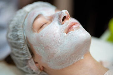 close-up of a girl's face at a cosmetologist during treatment procedures