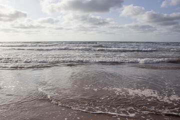 Fototapeta na wymiar Sea waves with white foam in the Ocean. place El Jadida Morocco. Summer 2023