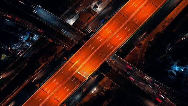 Night city lights drone time lapse at Bangkok, Thailand.
Flying at bird eye view of highway roads intersection with moving traffic. DJI Mavic, hyperlapse, abstract, lines, exposure, wallpaper