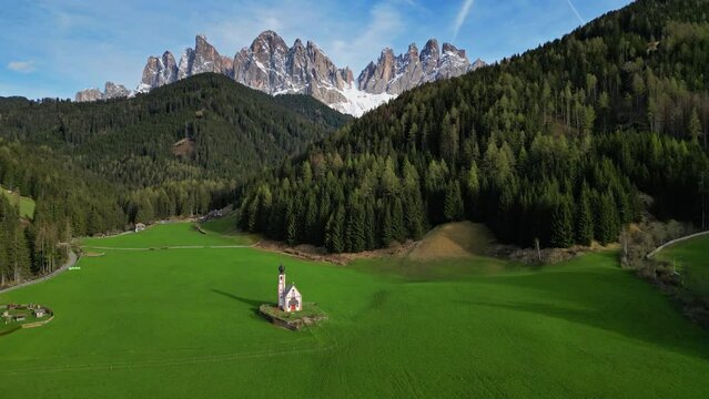 Spring landscape with shurch in Santa Magdalena village, Italian Dolomites Alps, in South Tyrol, Val di Funes, Italy, 4k
