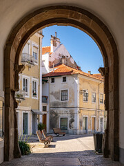 Picturesque archway and houses in Alcobaca, Portugal