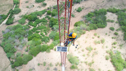 Men working on met tower seen from drone