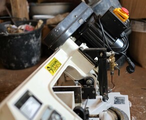 electric saw cutting wood