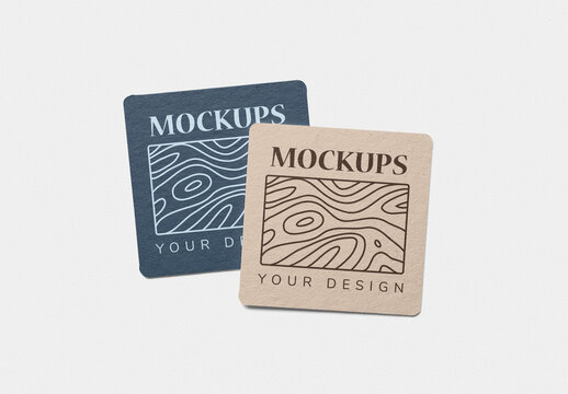 Mockup of two customizable square cardboard coasters with customizable background