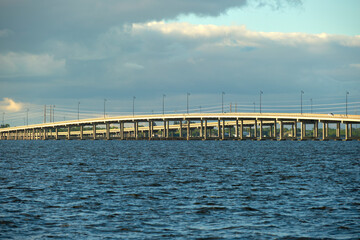 Barron Collier Bridge and Gilchrist Bridge in Florida with moving traffic. Transportation...