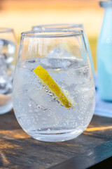 Cool glass of sparkling water with ice. Mountain mineral water