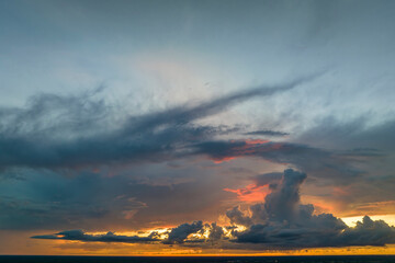 White fluffy cumulonimbus clouds forming before thunderstorm on evening sky. Changing stormy...