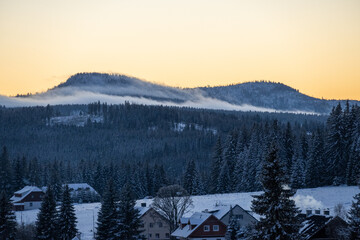 Mountains Roklany under the snow and in clouds, Sumava national park