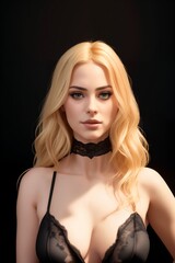 Beautiful blonde woman posing for black lingerie advertisement
