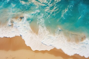 Fototapeta na wymiar Sandy beach, turquoise ocean and waves, top view, summer landscape