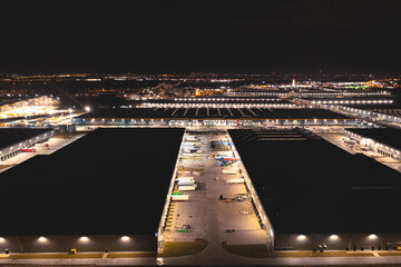 Aerial view of a logistics park with a warehouse. A large network of logistics warehouses for sorting goods and further shipment