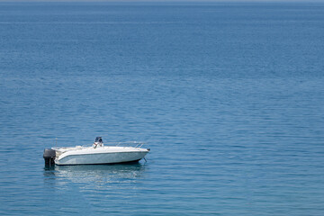 Lonely boat on the blue sea, seascape