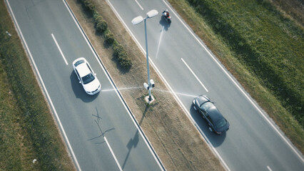 Camera on road scans the speed and license plates of passing cars. Control over autonomous...
