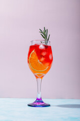 spritz summer drink on glassh with rosemary stick