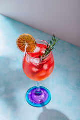 aperol spritz cocktail drink decorated with rosemary and orange slice