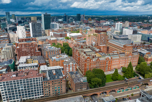 Aerial photo of Manchester downtown showing red brick buildings with distinctive Victorian architecture. 