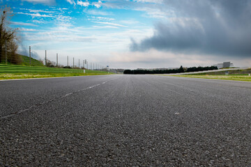 Straight asphalt drive way motor sport circuit landscape - obrazy, fototapety, plakaty
