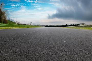 Fototapeten Straight asphalt drive way motor sport circuit landscape © fabioderby