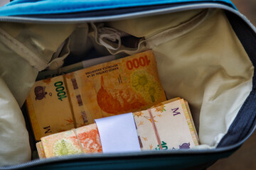 Bag with bundles of bills of one thousand Argentine pesos