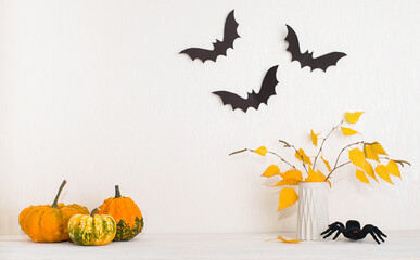 Halloween background with copy space. Decorative interior mockup with pumpkins bats spider and...