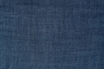 Dark blue jeans background. View from above