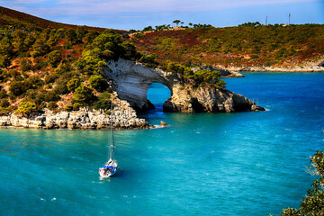 Aerial view of a yacht anchored by coastline, Sant'Antioco, Cagliari, Sardinia, Italy