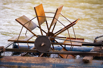 water pumping system by water wheel and pump