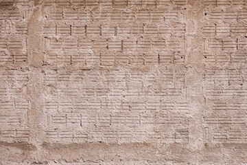 wall made of ceramic block bricks with splattered cement