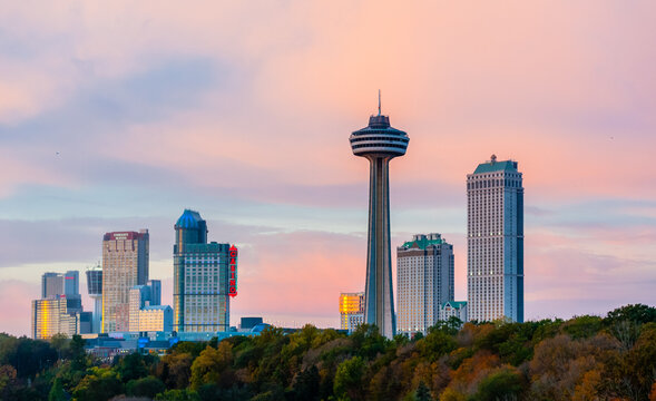 NIAGARA FALLS, ONTARIO, CANADA - OCTOBER 27, 2017: Hotels, casinos, and the Skylon Tower dominate the city skyline at sunset.