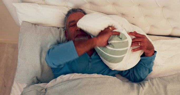 Sleep stress, senior and man with insomnia in bed at home with struggle and bad dream. House, top view and mature male person frustrated from fatigue and uncomfortable sleeping position with anxiety