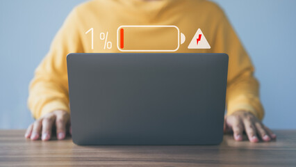 User is angry and frustrated when he learns that his laptop computer's battery is dead and did not bring the charger adapter. Concept of Technology and daily life of freelance. No power battery.