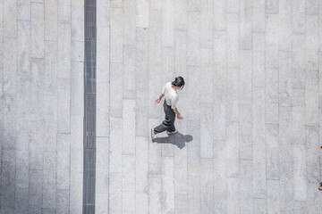 Top view crowd of people walks on a business street pedestrian in the city