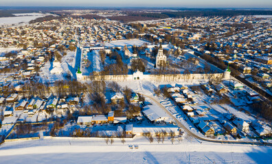 Aerial panoramic view of architectural ensemble of Holy Assumption convent in Russian town of Alexandrov on sunny winter day.