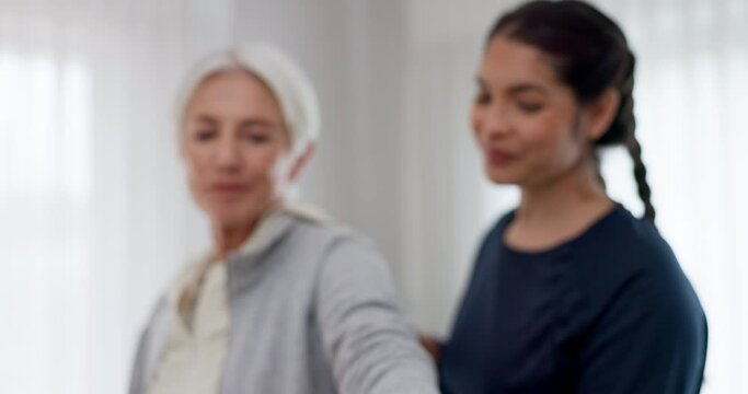 Woman, nurse and dumbbell in elderly care for physiotherapy, exercise or workout at old age home. Female doctor, caregiver or personal trainer helping senior patient in weightlifting for healthy body