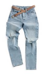 Rumpled light blue jeans with belt isolated on white, top view. Stylish clothes