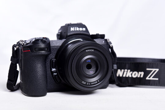camera photograph confrontation and competition between cameras. White background. The best mirrorless cameras from top brands.