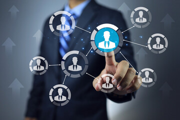 Businessman pointing on team leader to promote or assign the important mission to distribute in projectmanagement co working team as window person to report task or jobs progression to manager
