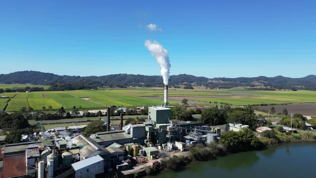 Smoke billowing from the Condong Sugar Mill on the banks of the Tweed River. Drone view
