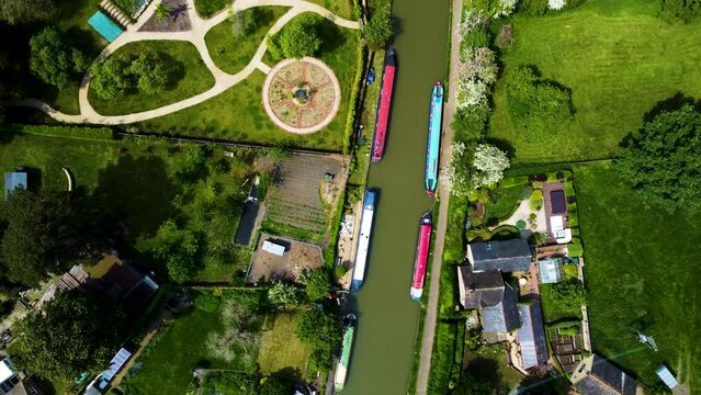 Drone descend rotate above grand union canal, stoke bruerne