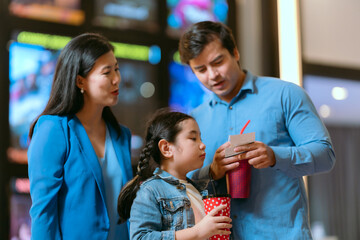 Families are using movie tickets to check and chat before going in.