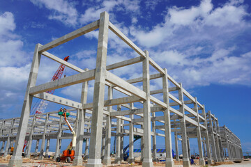 Precast concrete structures building installation at construction site on oil and gas plant.