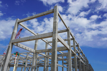 Precast concrete structures building installation at construction site on oil and gas plant.