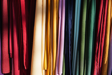 colorful fabric colorful headscarves hanging in a fabric shop window