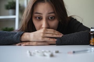 close up hand of young women. Stressed female taking drug overdose.