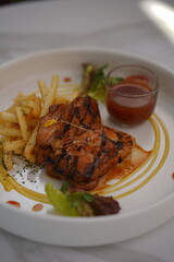 Chicken Steak with Fried Fries Vegetables and Red Sauce