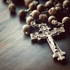 Fotobehang Rosary catholic cross on wooden table © Erica
