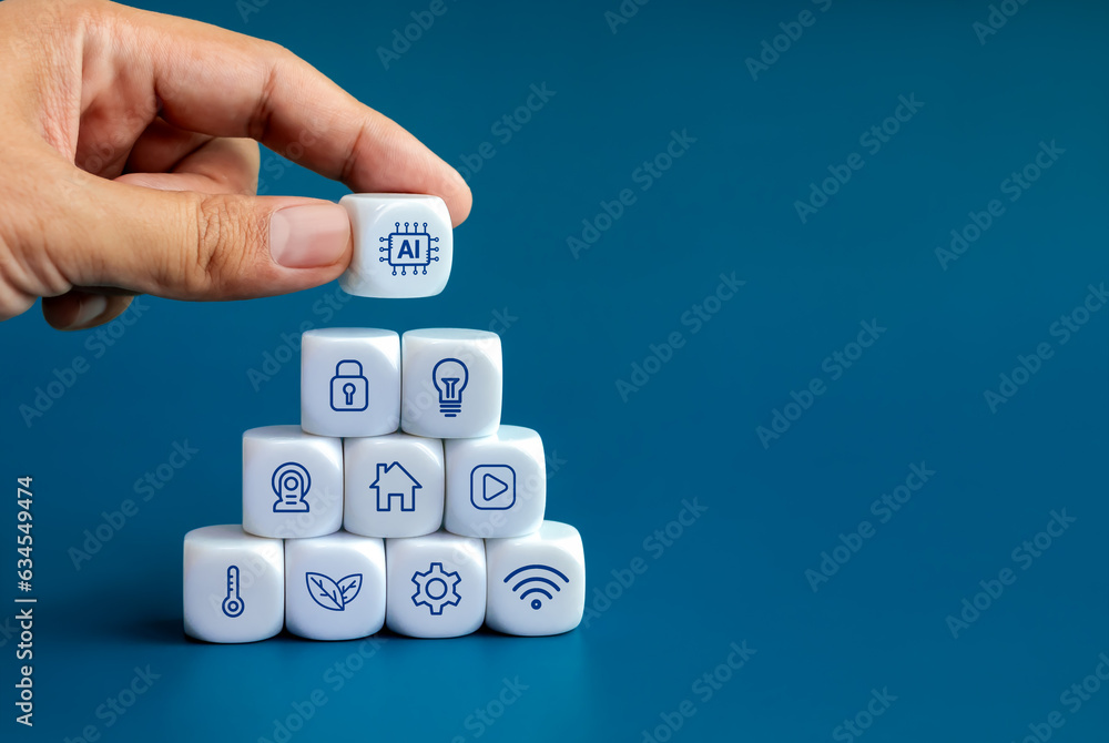 Poster AI technology and smart home technology concepts. Artificial intelligence icon in human hand put on top of triangle shape blocks stack with home digital management control symbols on blue background.
