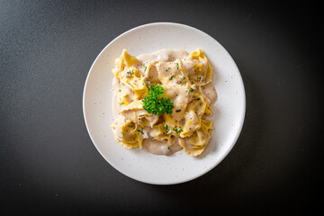 tortellini pasta with mushroom cream sauce and cheese