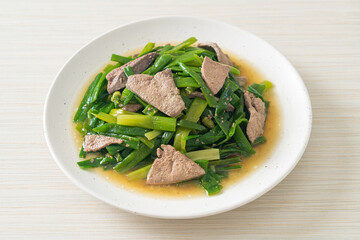 Stir-fried onion flower stem with pork liver